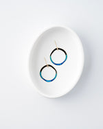 Hand patinaed open circles in black to shades of blue and turquoise ombre