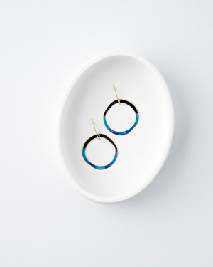 Hand patinaed open circles in black to shades of blue and turquoise ombre