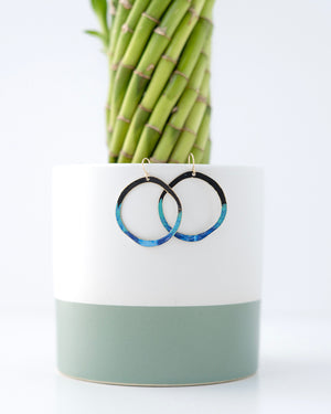 Hand patinaed open circles in black to shades of blue and turquoise ombre