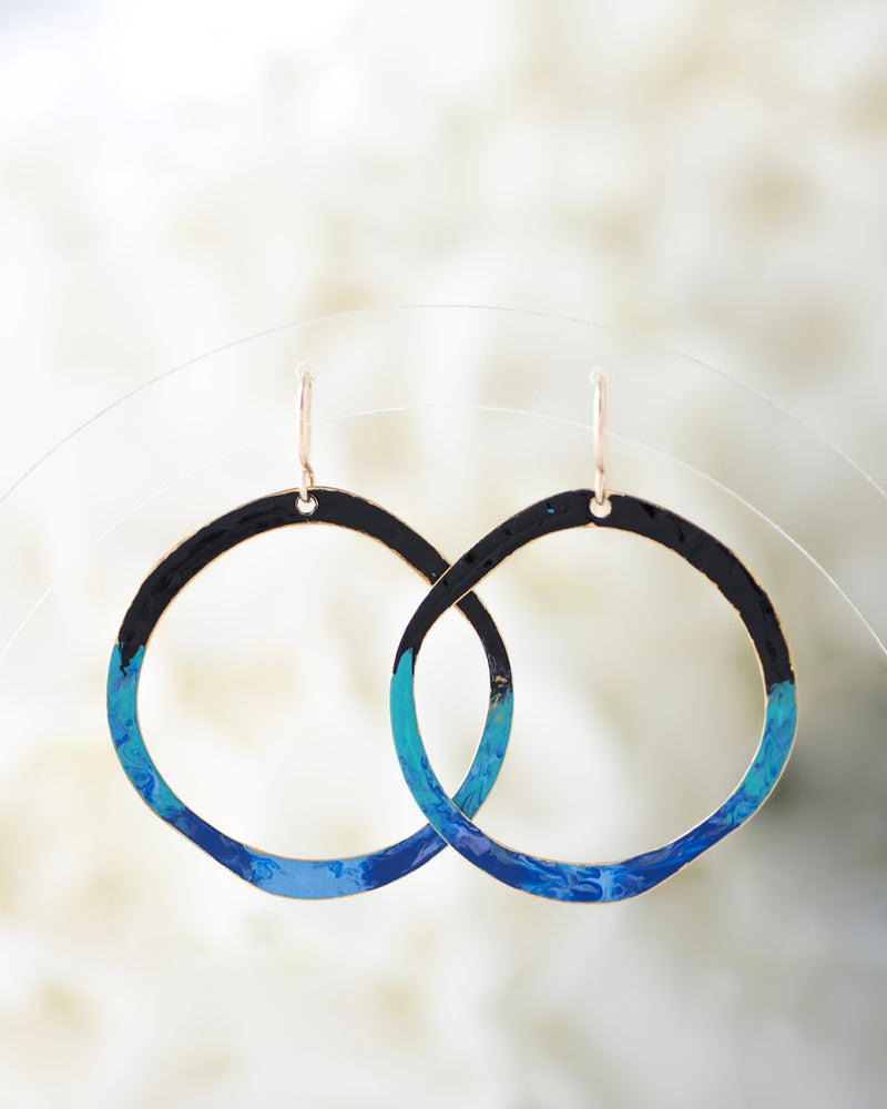 Hand patinaed open circles in black to shades of blue and turquoise ombre