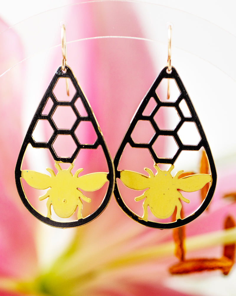 Yellow Bees on Black Honeycomb